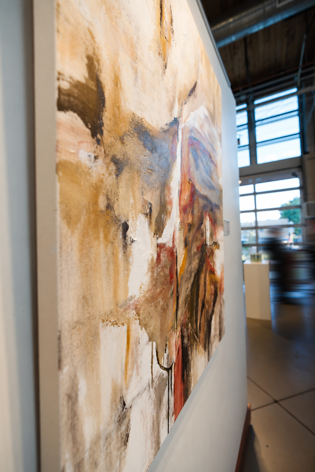 Spanish Dance: an angled view of the textured canvas, with background visitors motion-blurred.