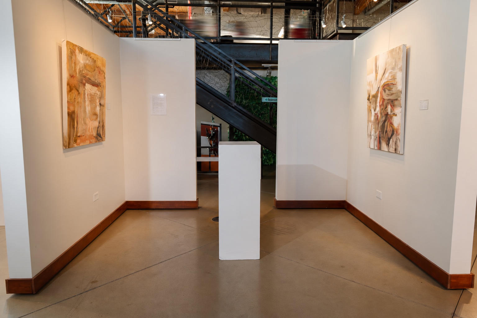 Baguette Days and Spanish Dance installed on opposite gallery walls.