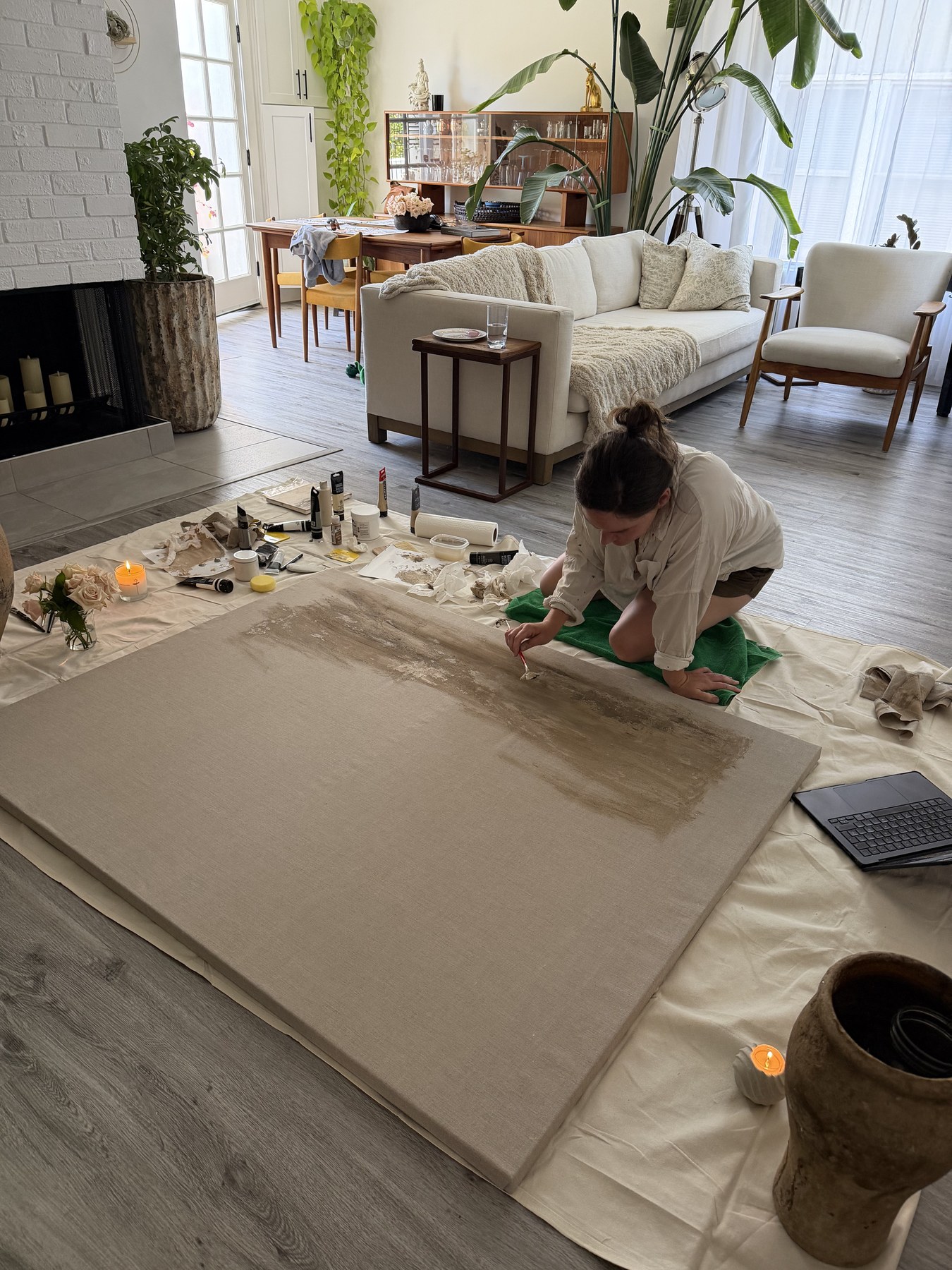 Kellsie Moore creating a Becoming Home work on raw canvas.